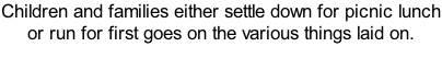 Children and families either settle down for picnic lunch or run for first goes on the various things laid on.